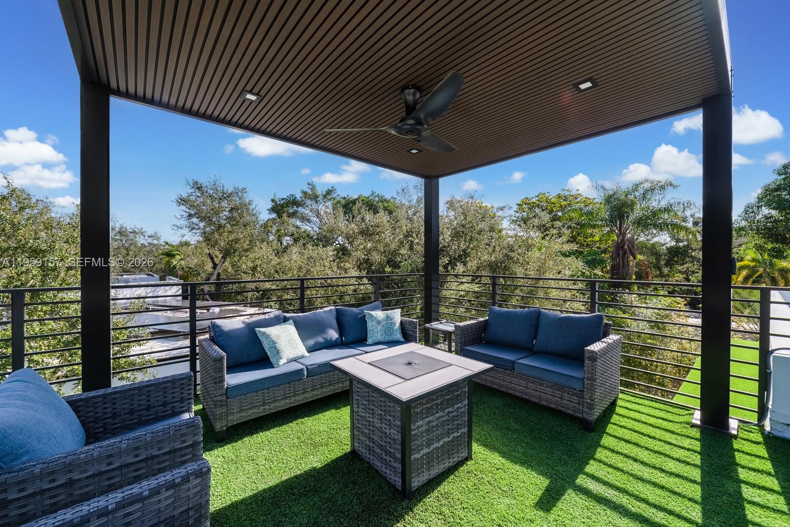 1780 Chucunantah Road Miami, FL 33133 - Photo 30 of 34 a view of a patio with couches chairs dining table and chairs