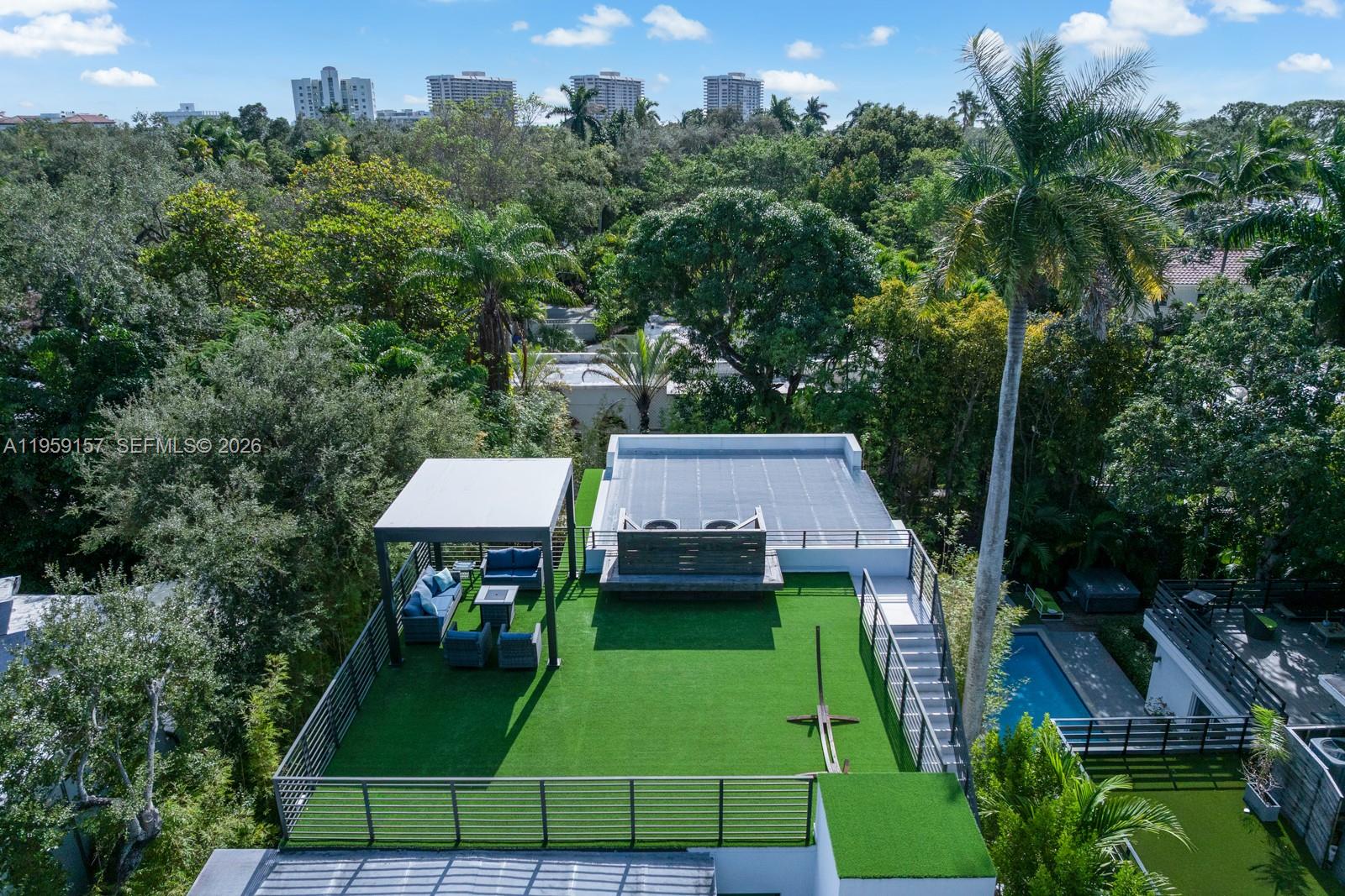 1780 Chucunantah Road Miami, FL 33133 - Photo 31 of 34 aerial view of a house with a backyard