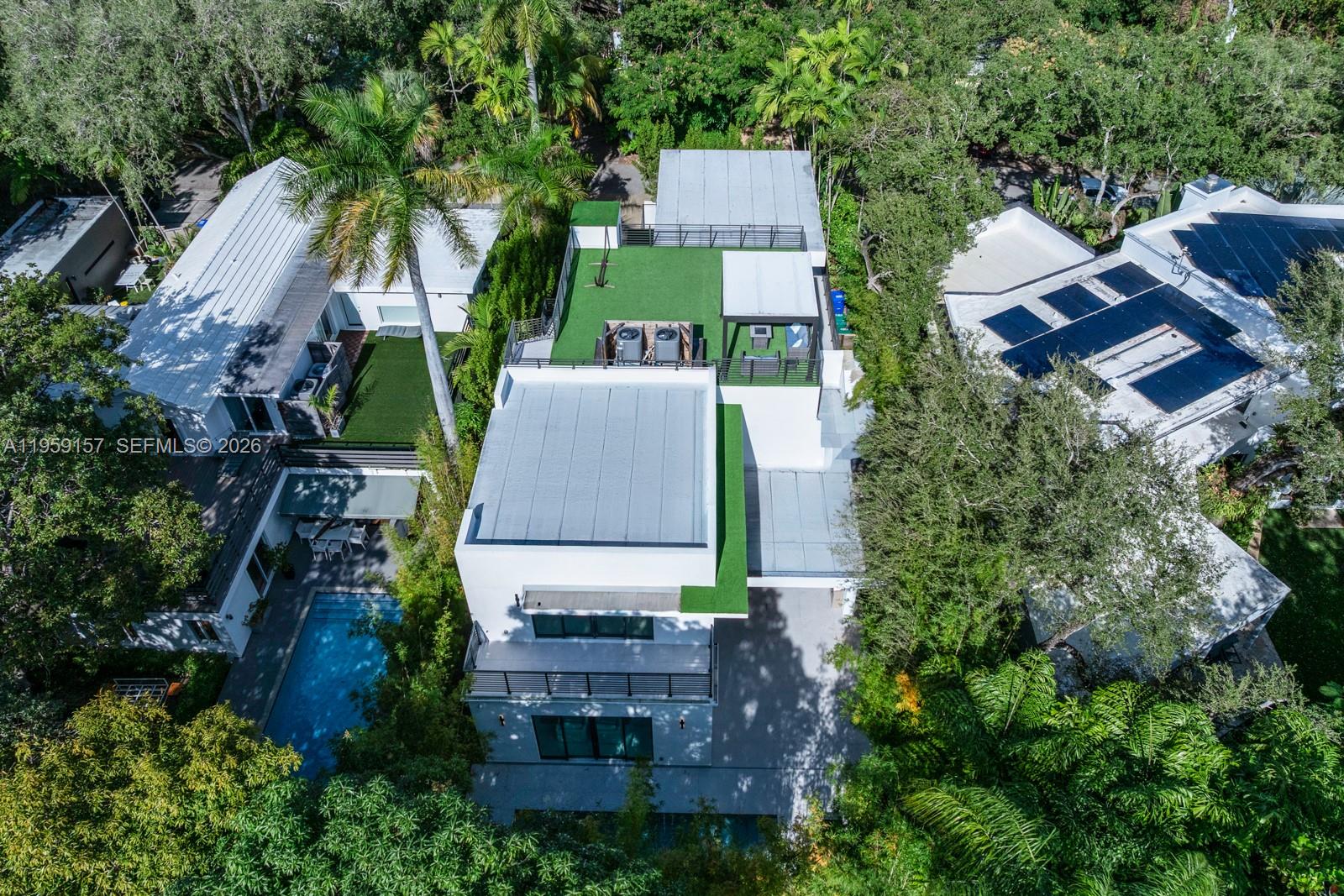 1780 Chucunantah Road Miami, FL 33133 - Photo 32 of 34 an aerial view of a house with a garden