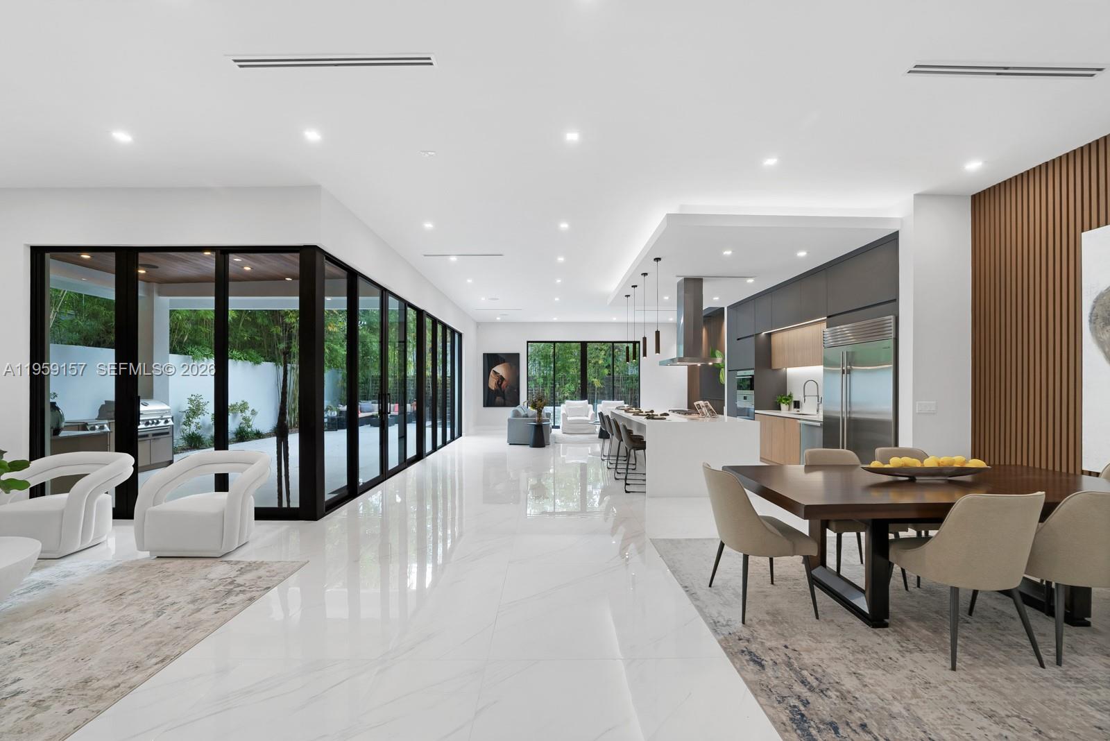 1780 Chucunantah Road Miami, FL 33133 - Photo 6 of 34 a view of a dining room with furniture window and outside view