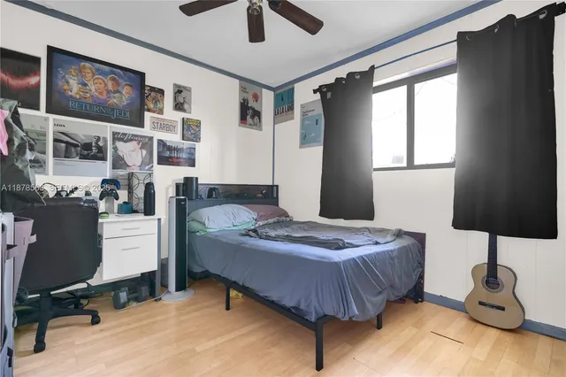 a bedroom that has a bed and a chair in it