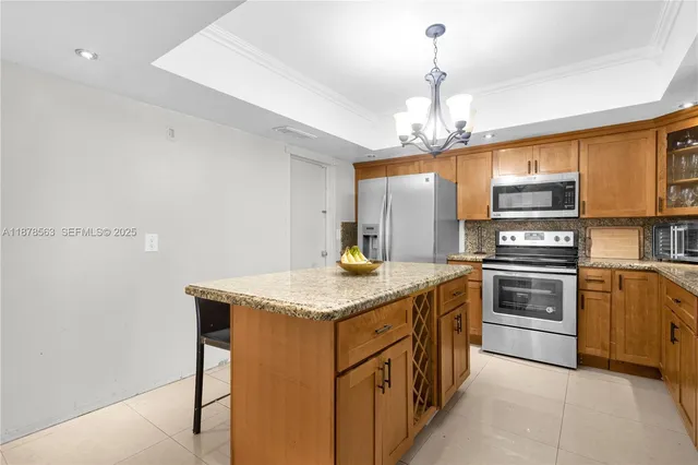 a kitchen with stainless steel appliances granite countertop a sink and cabinets