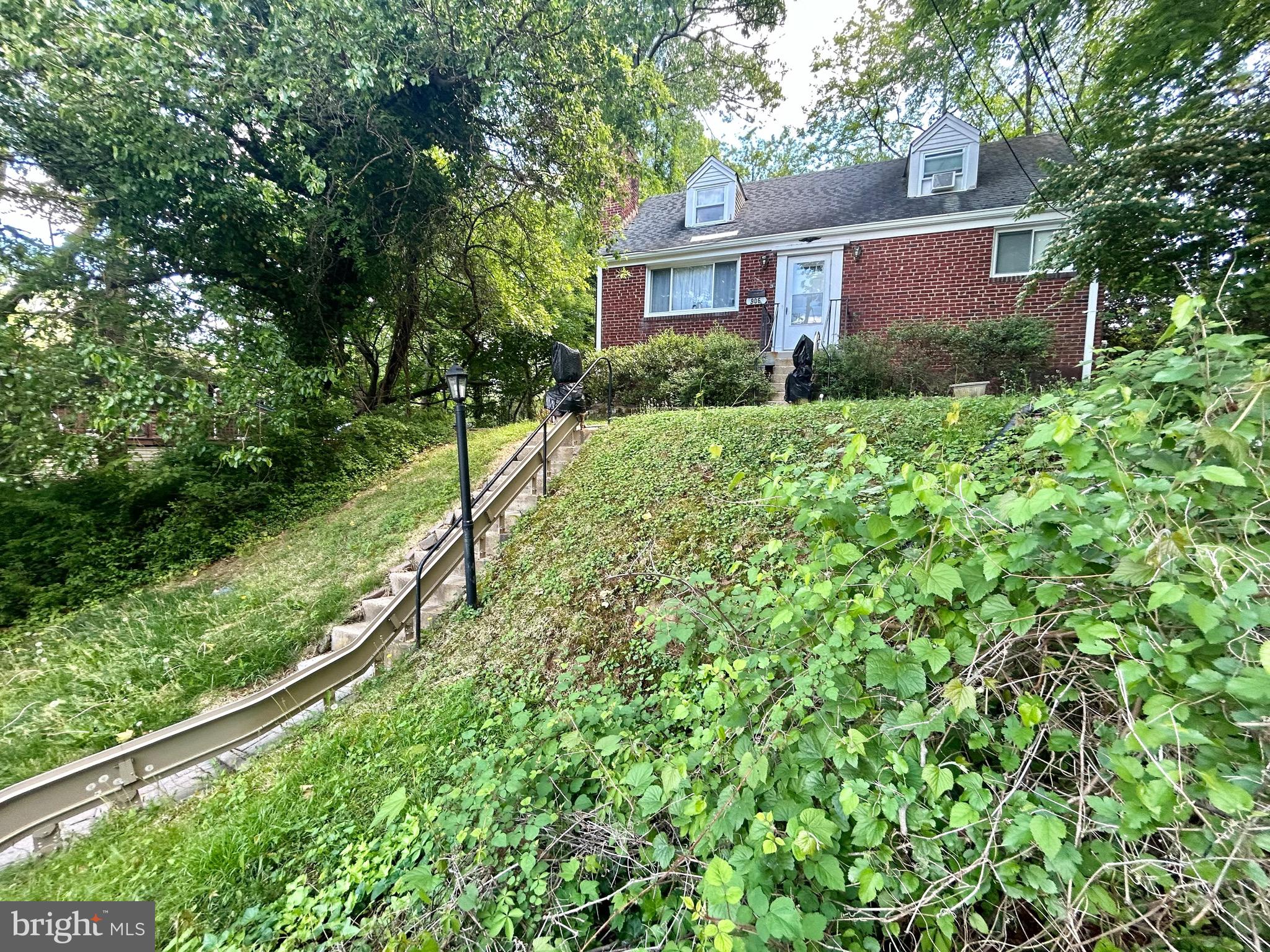 906 Dryden Court Silver Spring, MD 20901 - Photo 4 of 12 a view of a house with a yard and plants