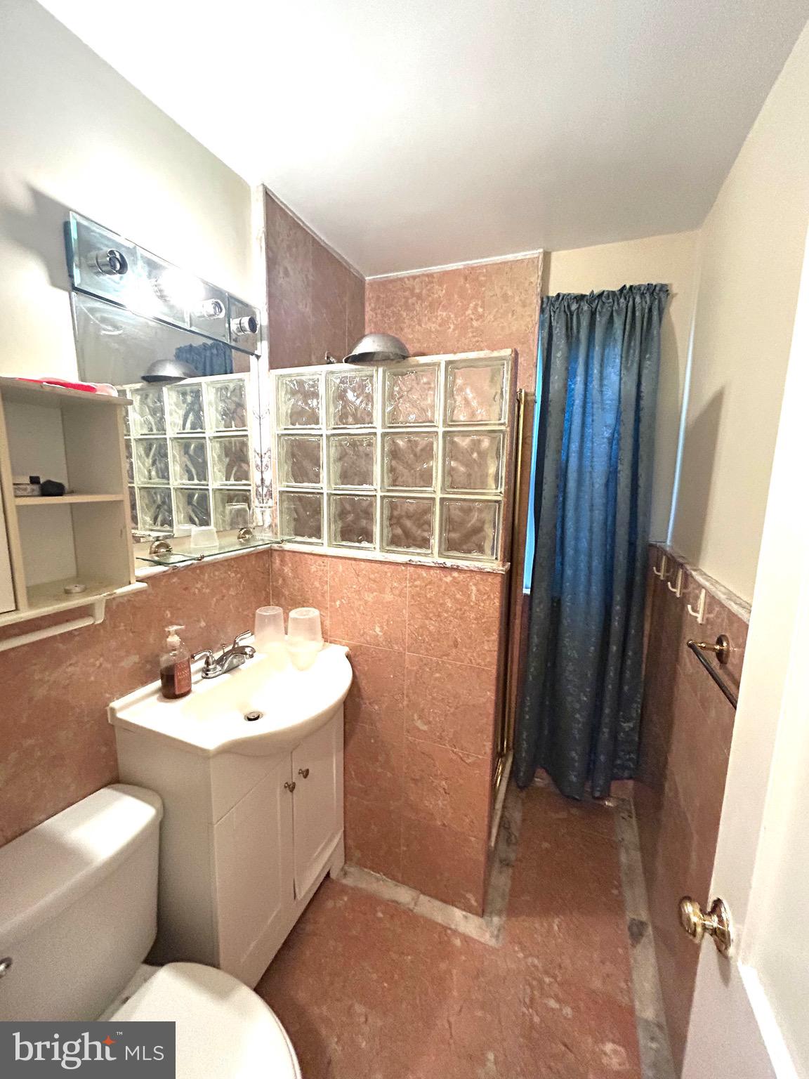 906 Dryden Court Silver Spring, MD 20901 - Photo 10 of 12 a bathroom with a sink toilet and shower