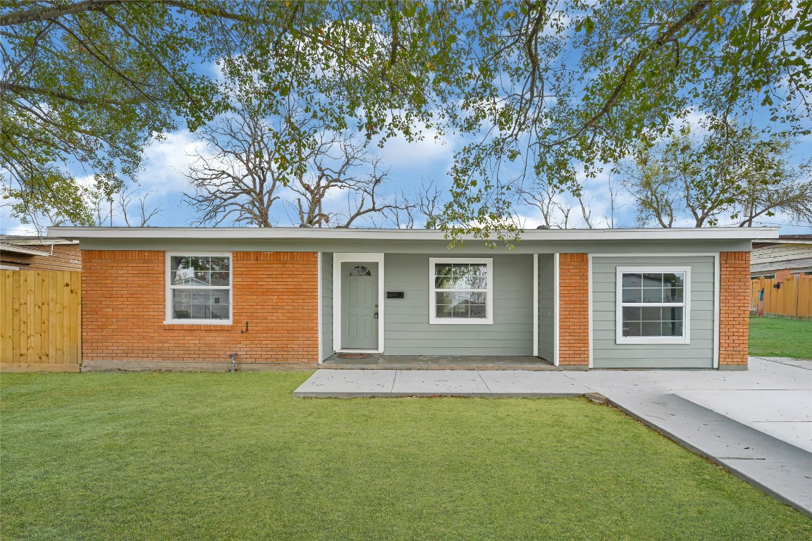front view of a house with a garden