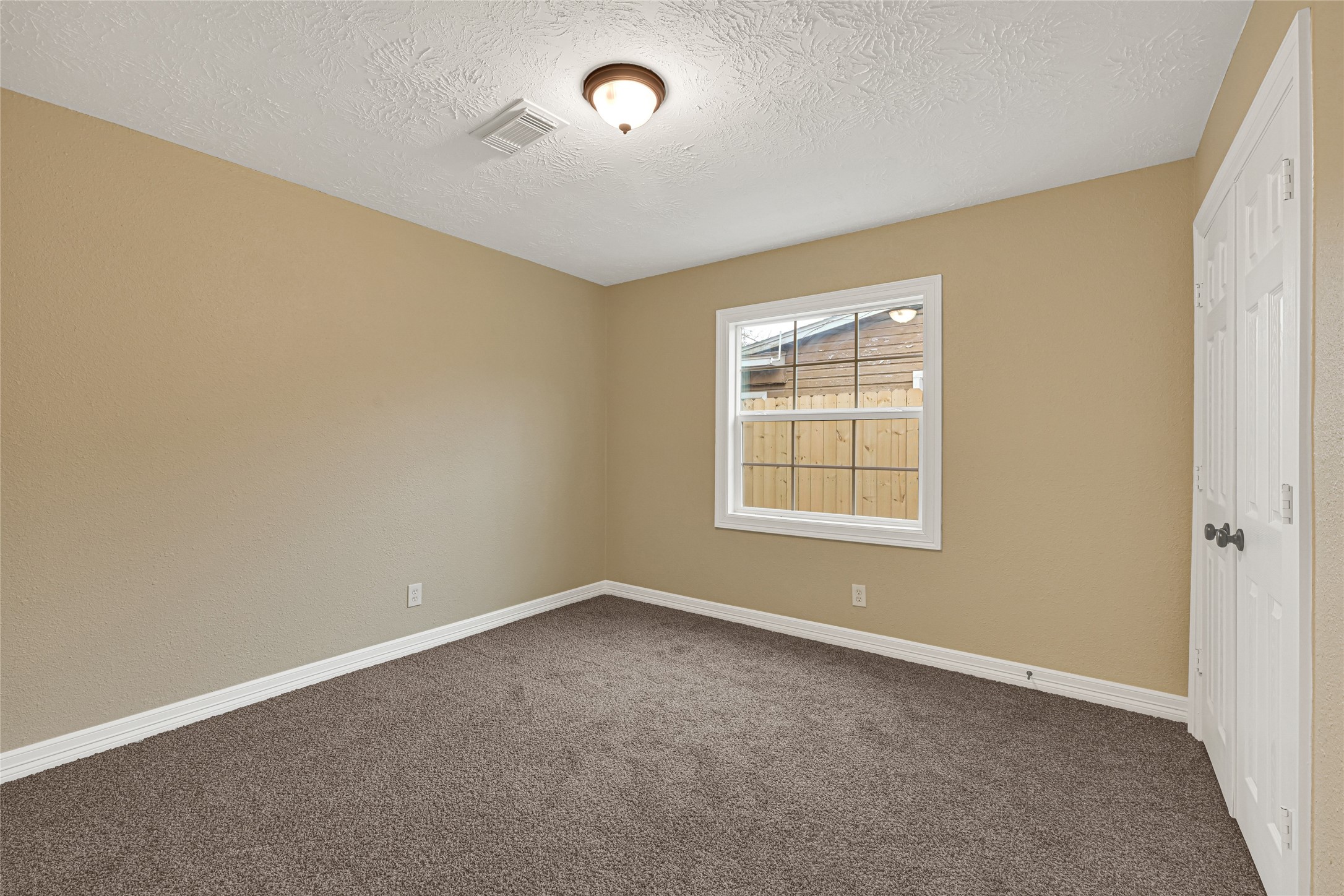 8526 Vennard Road Houston, TX 77034 - Photo 12 of 22 an empty room with windows