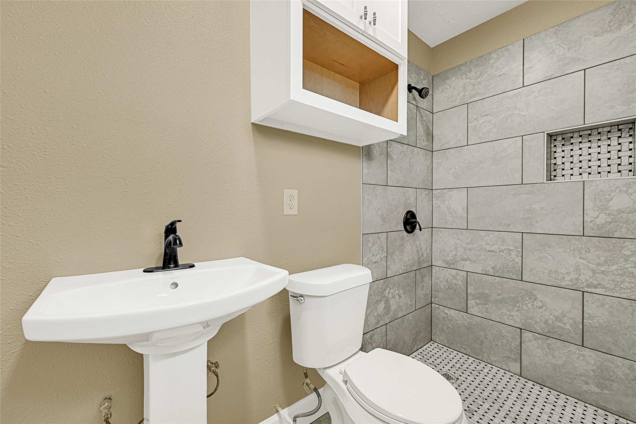 8526 Vennard Road Houston, TX 77034 - Photo 14 of 22 a bathroom with a toilet sink and mirror