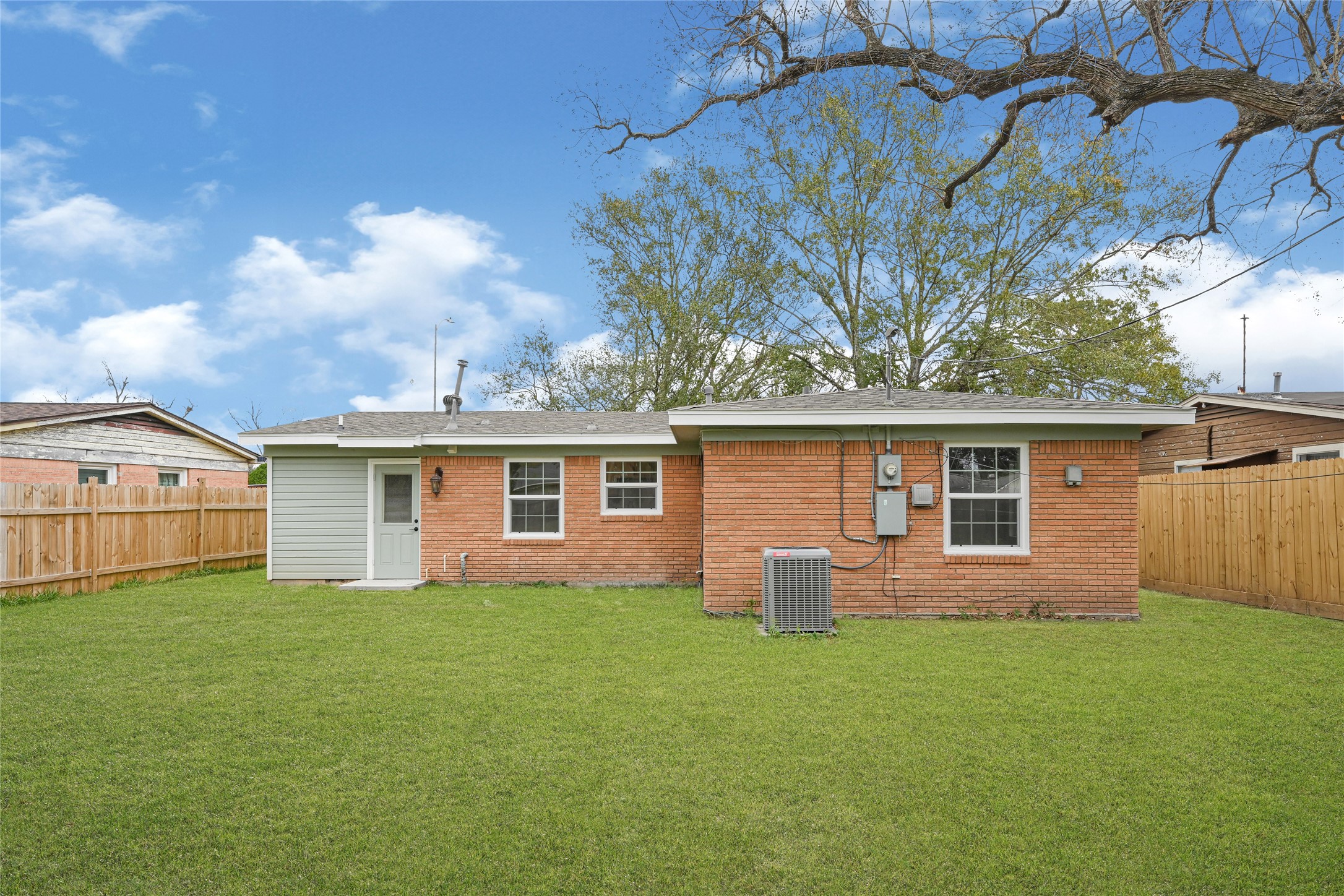 8526 Vennard Road Houston, TX 77034 - Photo 19 of 22 a front view of house with yard and green space