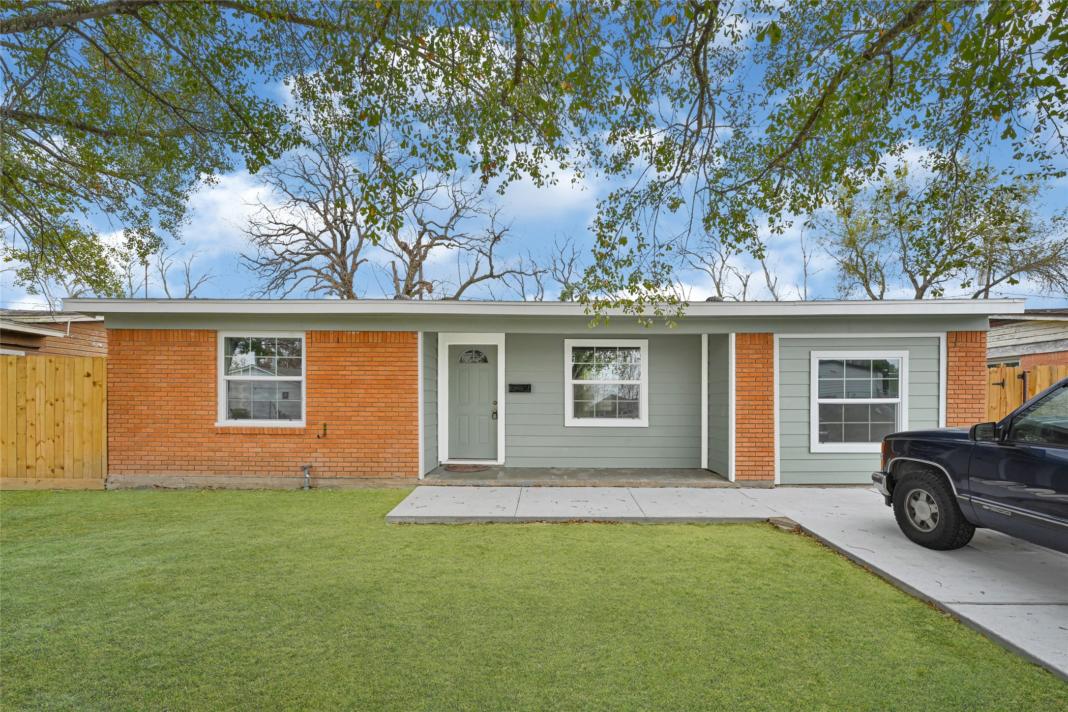 8526 Vennard Road Houston, TX 77034 - Photo 2 of 22 front view of a house with a yard