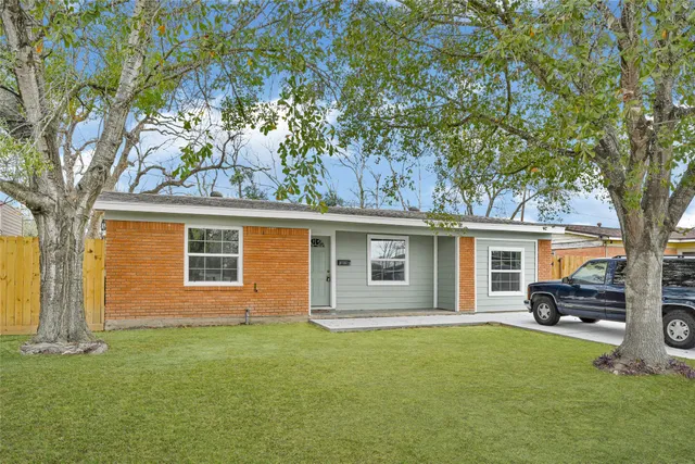 front view of a house with a garden