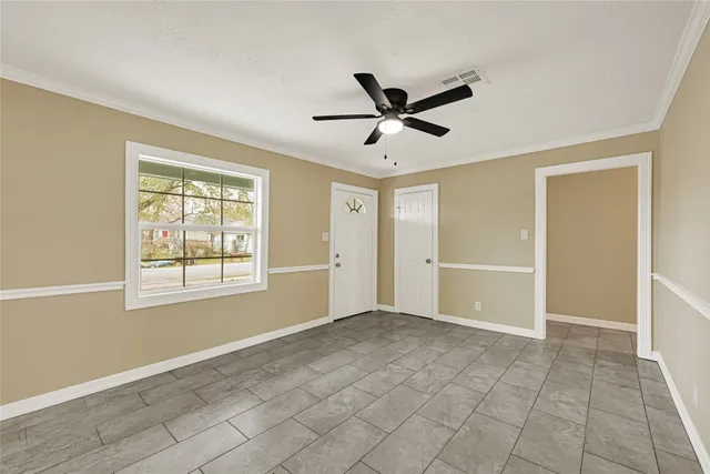 a view of an empty room with a window