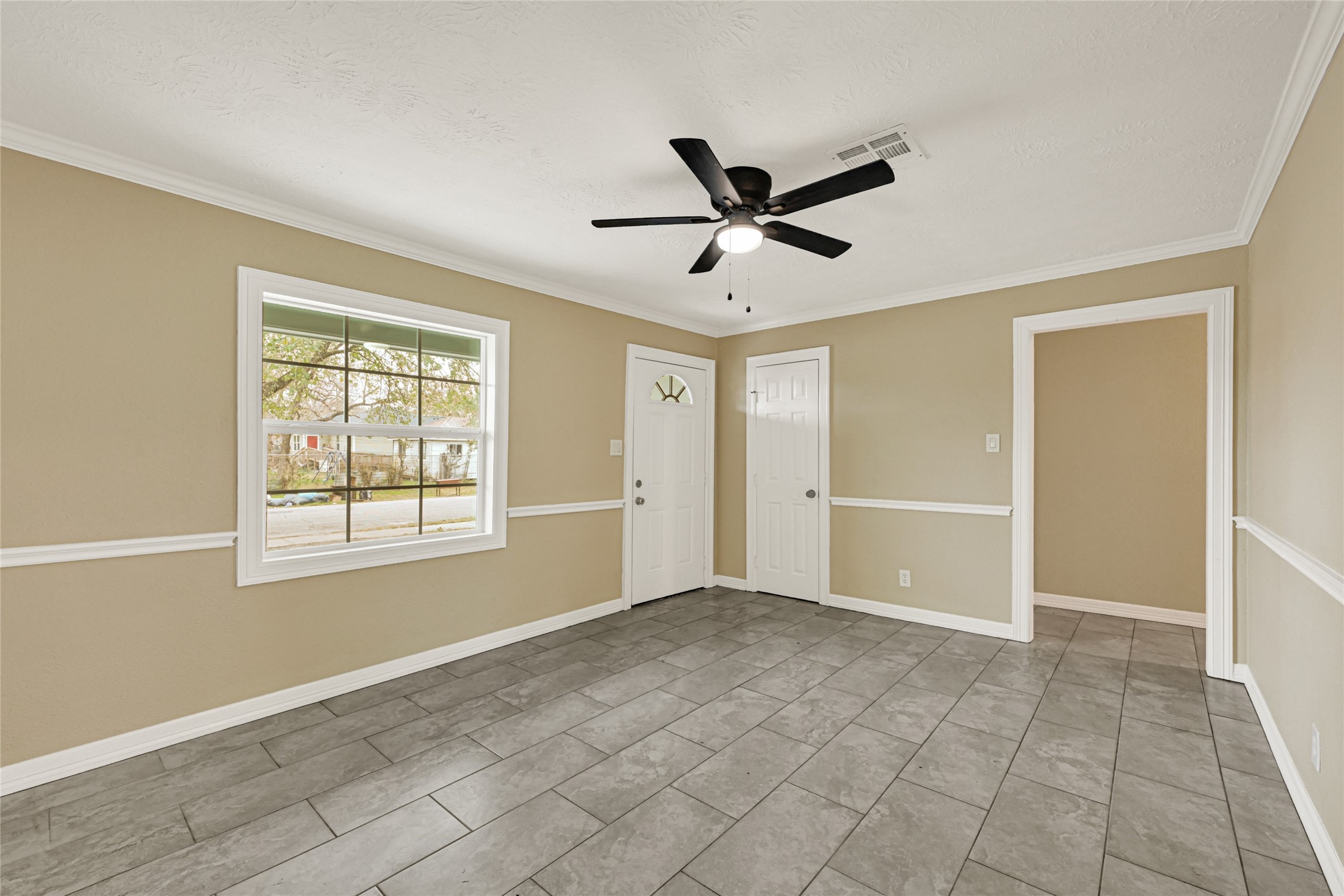 8526 Vennard Road Houston, TX 77034 - Photo 6 of 22 a view of an empty room with a window
