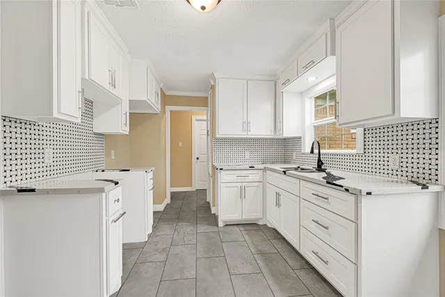 a kitchen with a stove a sink and a refrigerator