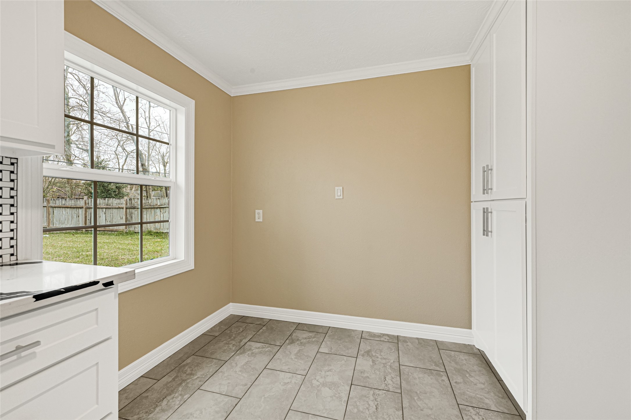 8526 Vennard Road Houston, TX 77034 - Photo 9 of 22 a view of an empty room with a window