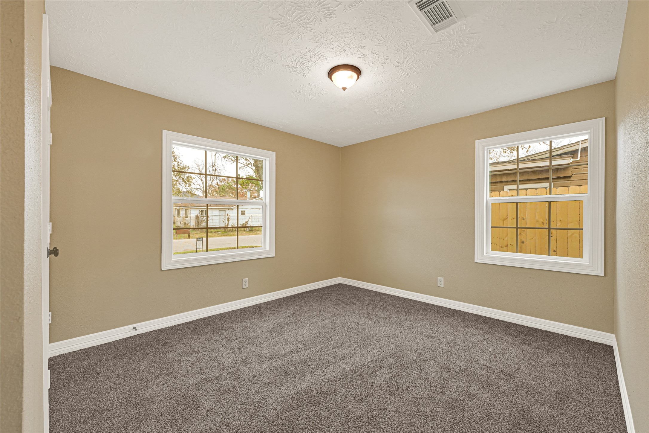 8526 Vennard Road Houston, TX 77034 - Photo 10 of 22 a view of an empty room with a window