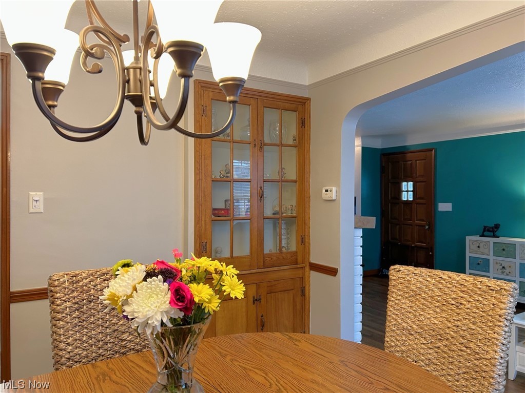 1748 Sunview Road Lyndhurst, OH 44124 - Photo 16 of 41 Dining room featuring a built-in cabinet and hardwood flooring.