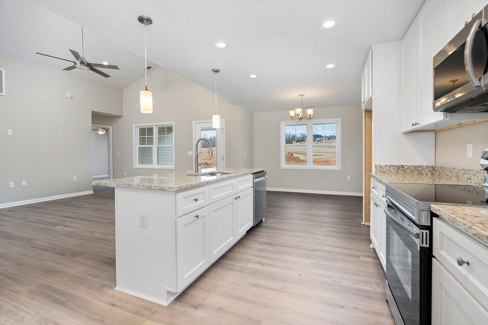 205 Spring Run Lane Waynesboro, VA 22980 - Photo 12 of 35 a large kitchen with stainless steel appliances granite countertop a lot of counter space and wooden floor