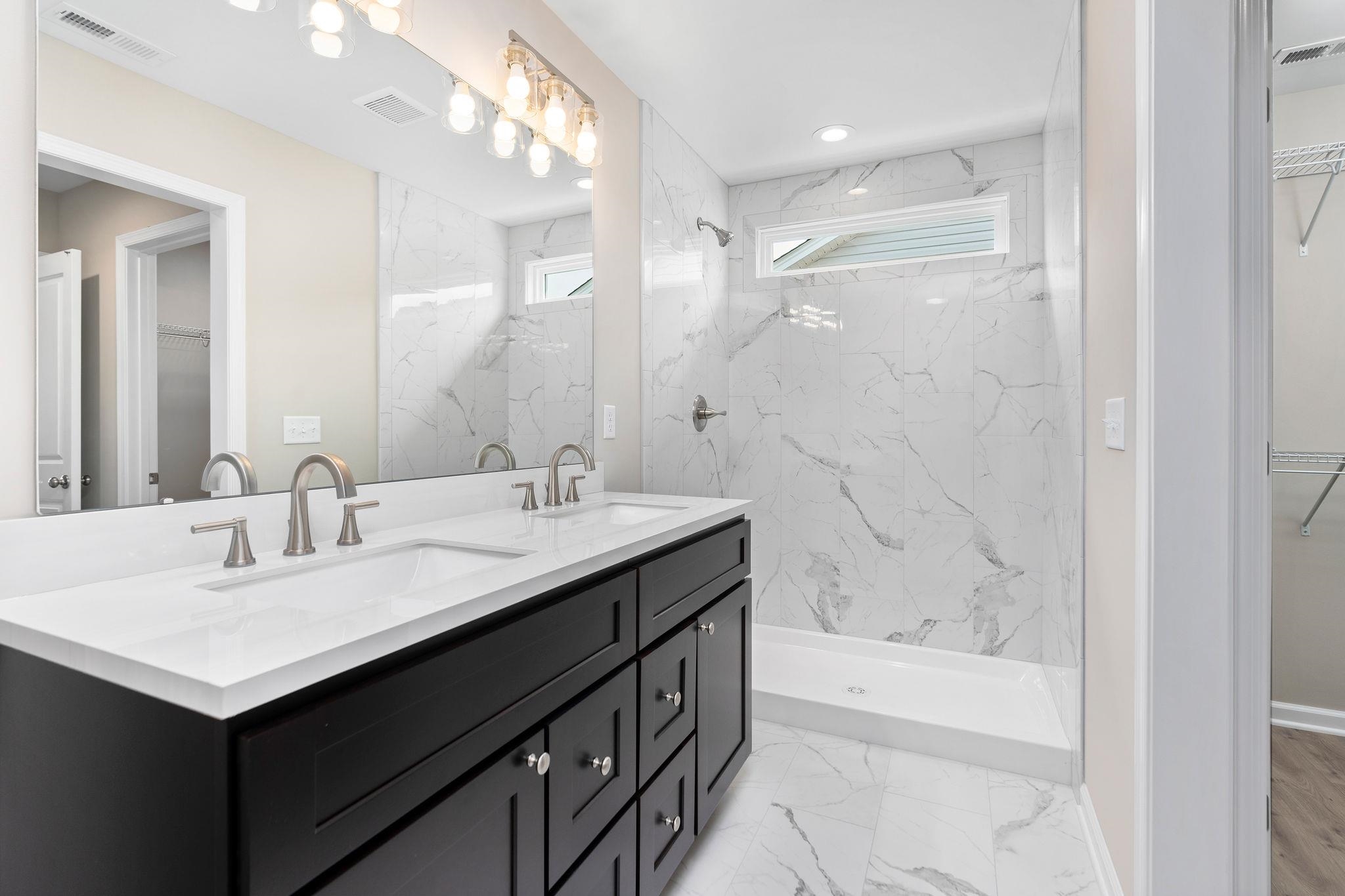 205 Spring Run Lane Waynesboro, VA 22980 - Photo 17 of 35 a bathroom with a bathtub double vanity sink and mirror