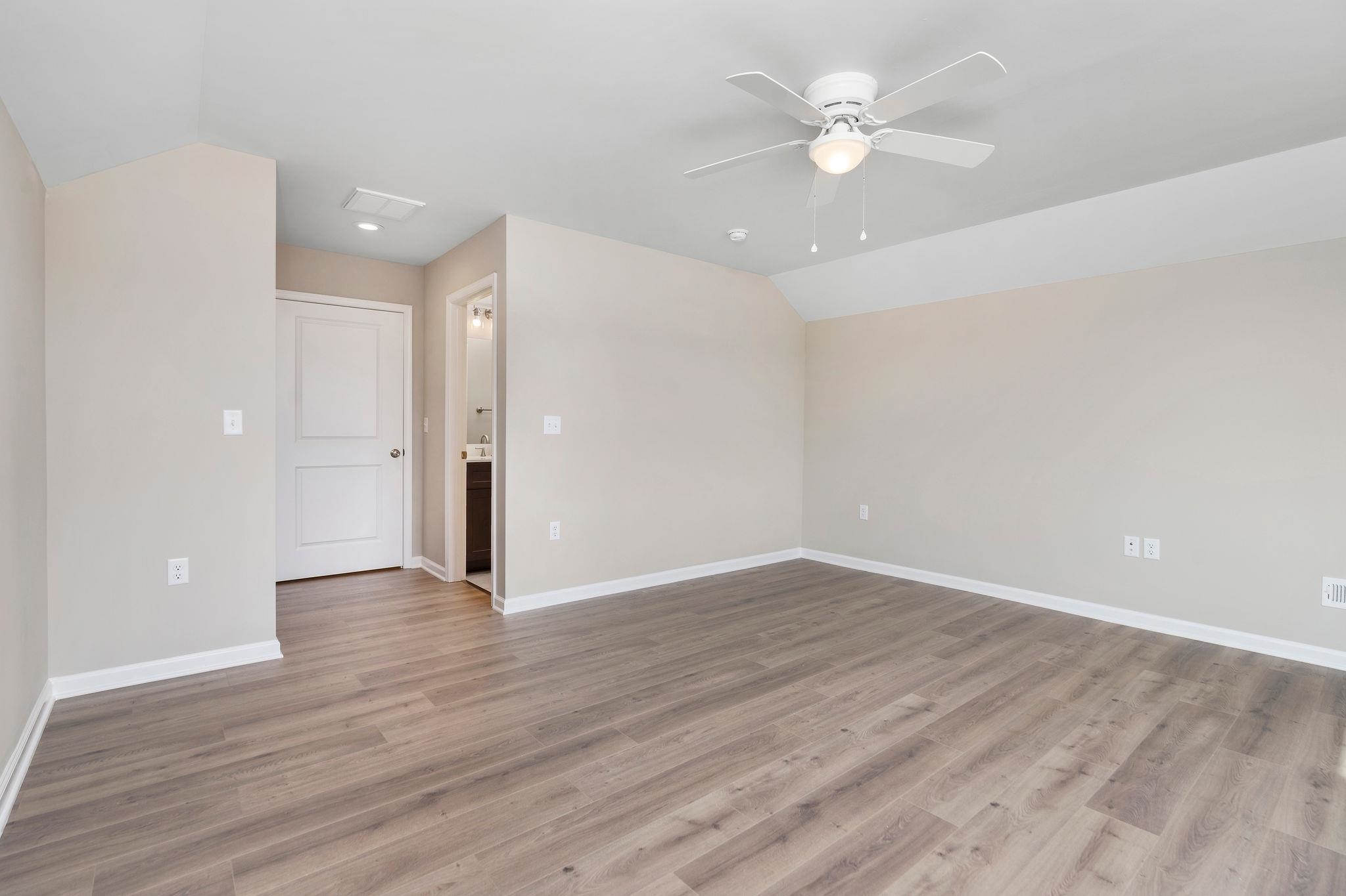 205 Spring Run Lane Waynesboro, VA 22980 - Photo 27 of 35 a view of an empty room with wooden floor and a ceiling fan