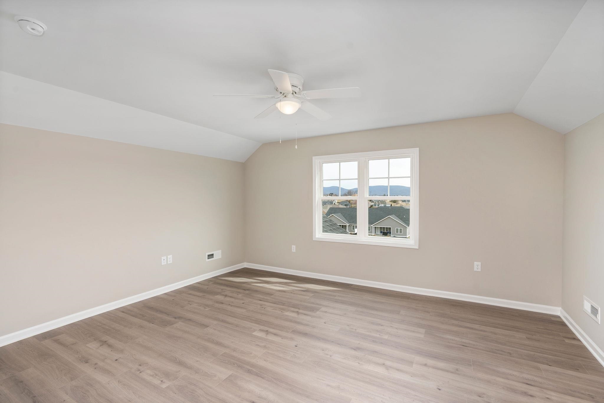 205 Spring Run Lane Waynesboro, VA 22980 - Photo 28 of 35 an empty room with wooden floor and windows