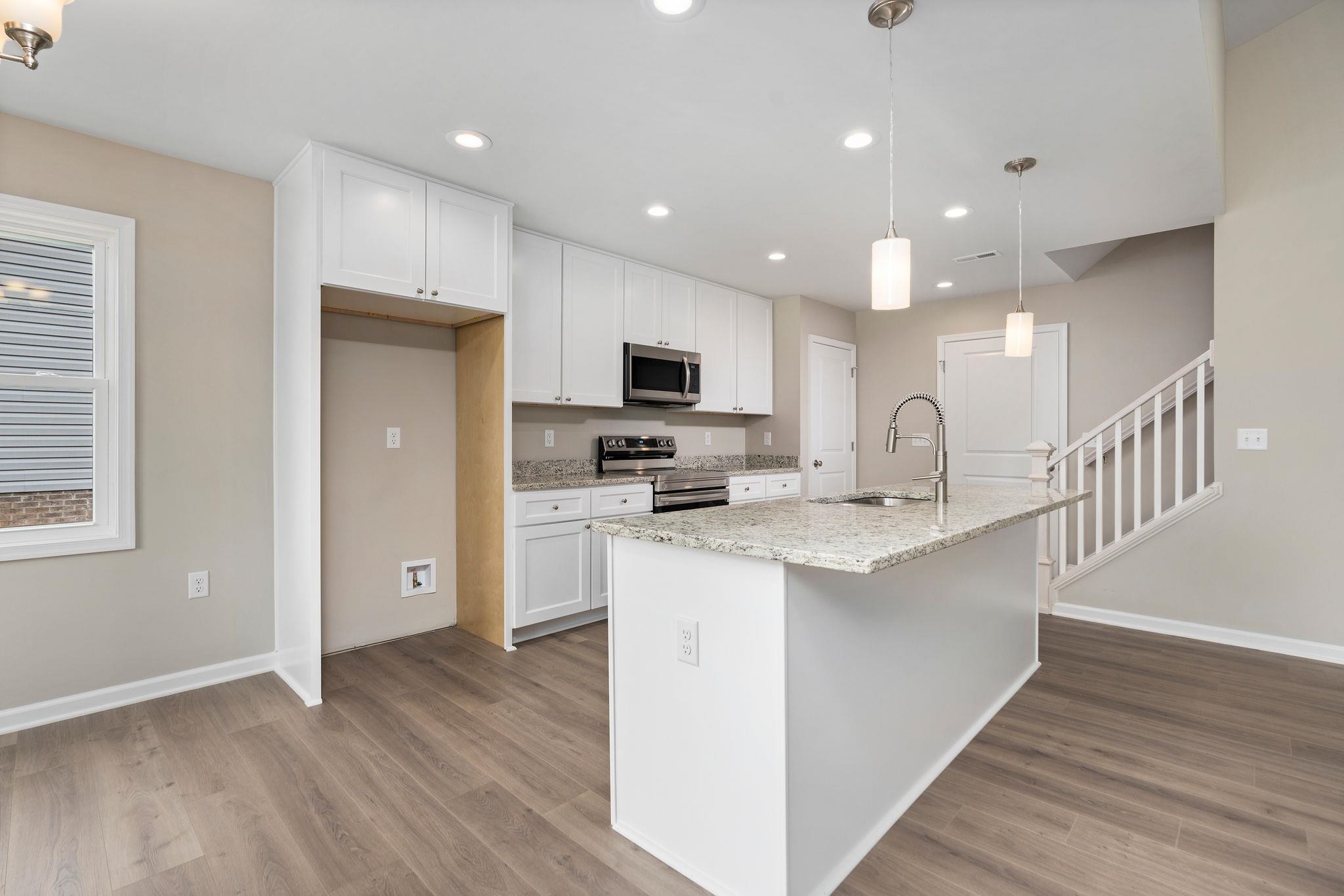205 Spring Run Lane Waynesboro, VA 22980 - Photo 8 of 35 a kitchen with stainless steel appliances granite countertop a sink a stove a refrigerator and a microwave