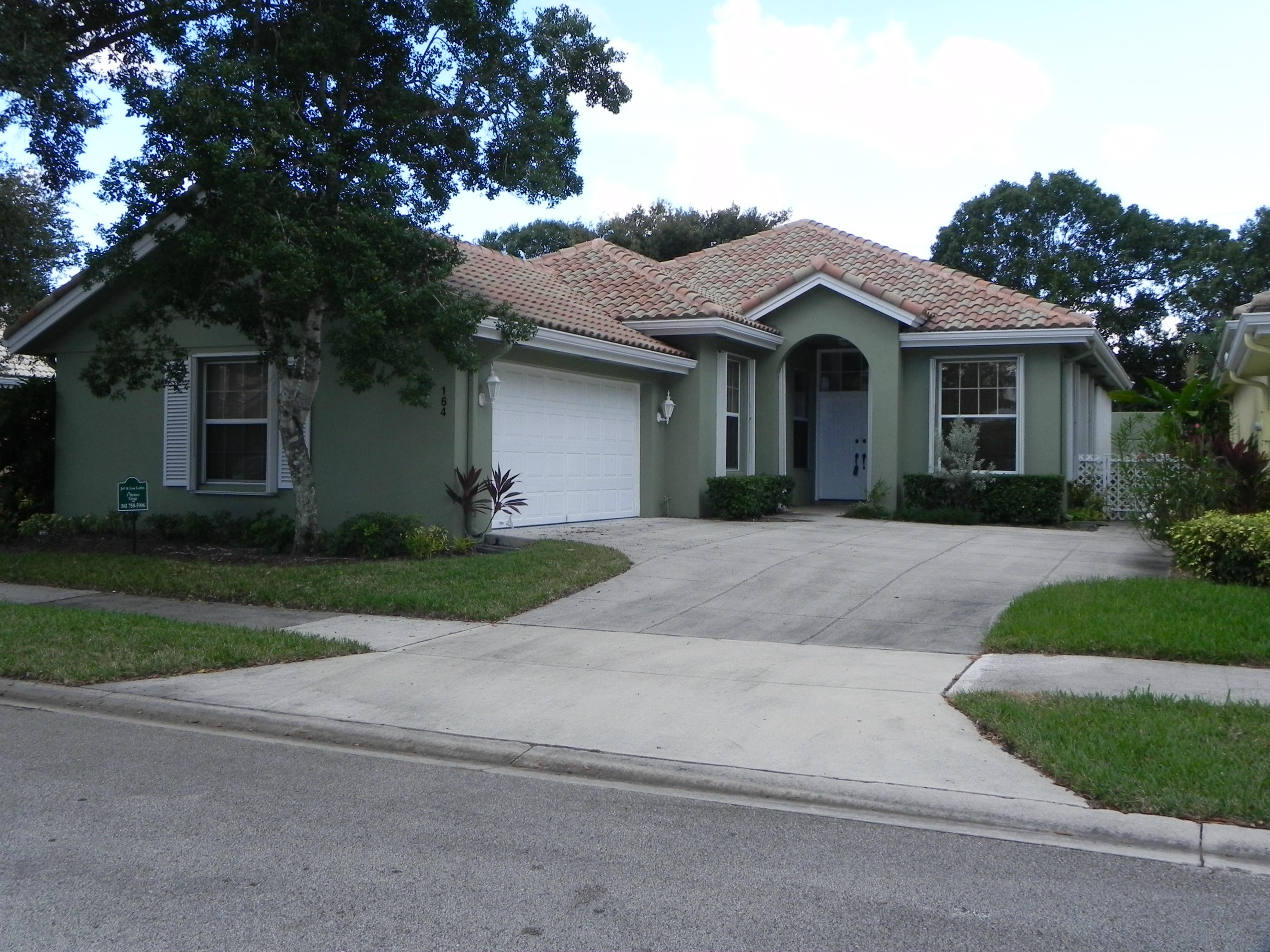 164 Hampton Circle Jupiter, FL 33458 - Photo 1 of 25 FRONT VIEW OF HAMPTON CIRCLE
