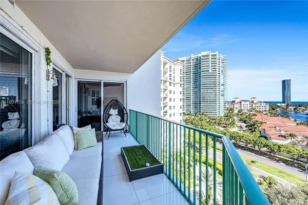 a view of a balcony with furniture