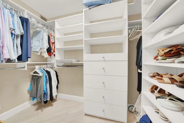 a bedroom with two beds and a table