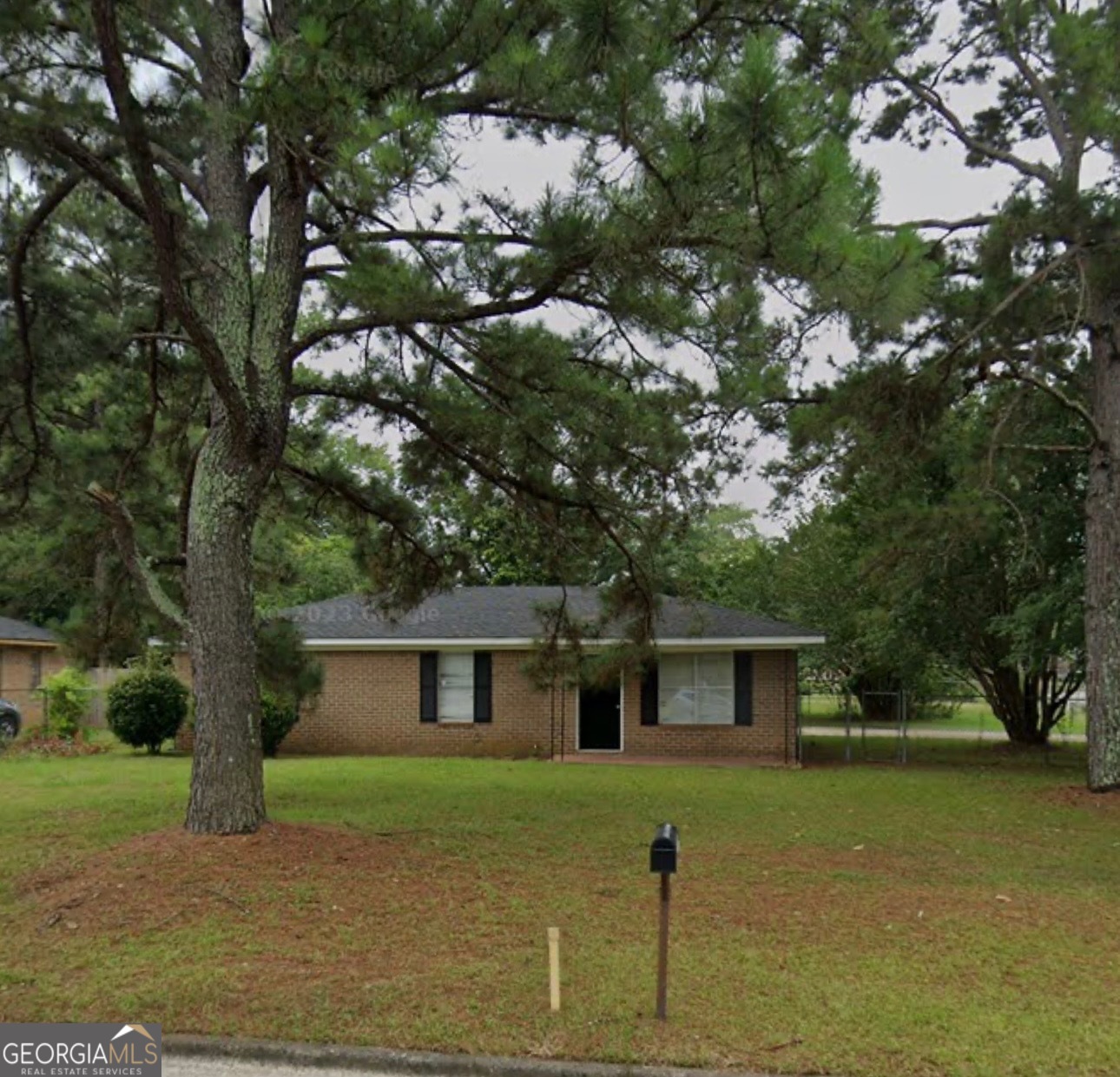 538 Southgate Avenue Albany, GA 31701 - Photo 1 of 16 a front view of a house with a garden and trees