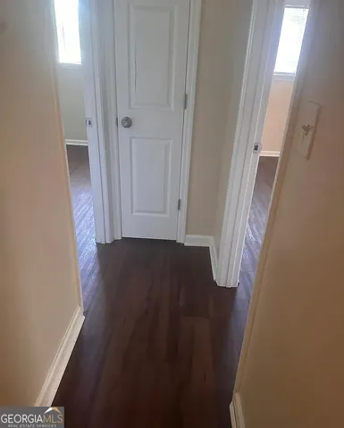 a view of front door with wooden floor