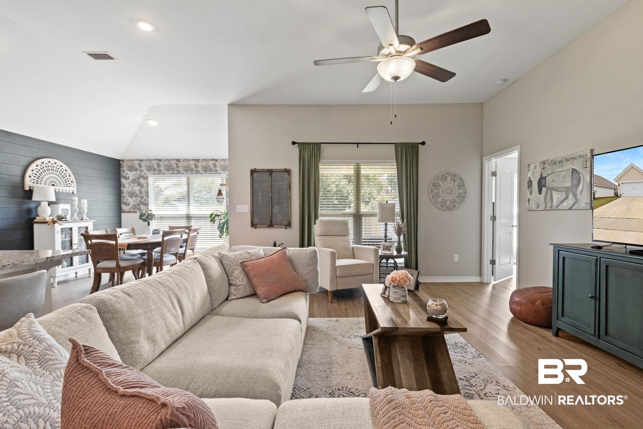 1203 Hayward Loop Foley, AL 36535 - Photo 7 of 41 Living area featuring light wood finished floors, vaulted ceiling, recessed lighting, ceiling fan, and an accent wall