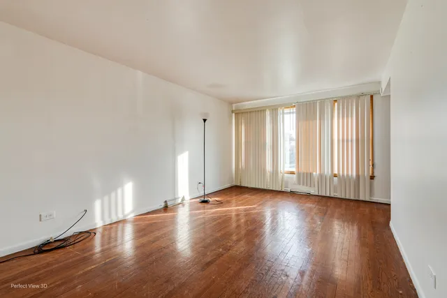 a view of a livingroom with wooden floor