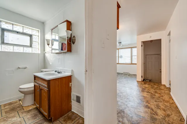 a utility room with cabinets washer and dryer