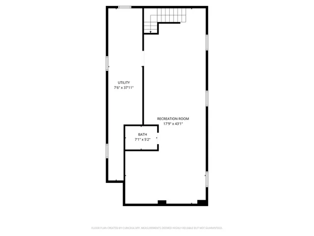 a picture of a bench in front of a wall