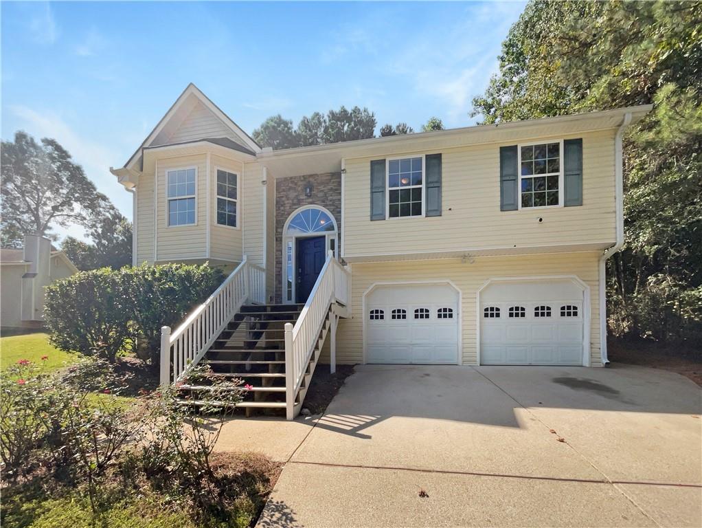 a front view of a house with stairs