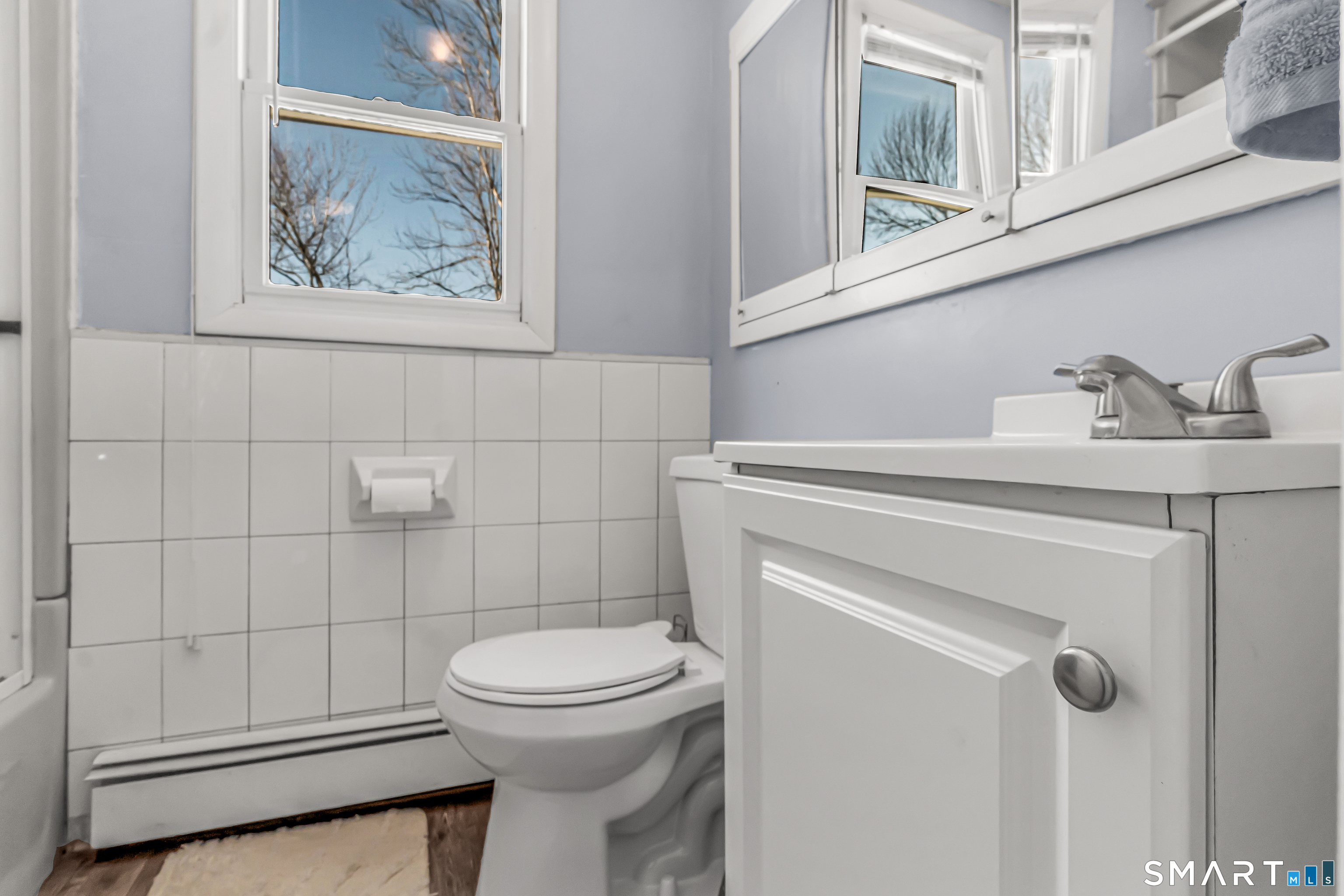 106 Hawley Avenue Milford, CT 06460 - Photo 14 of 39 a bathroom with a toilet and a sink