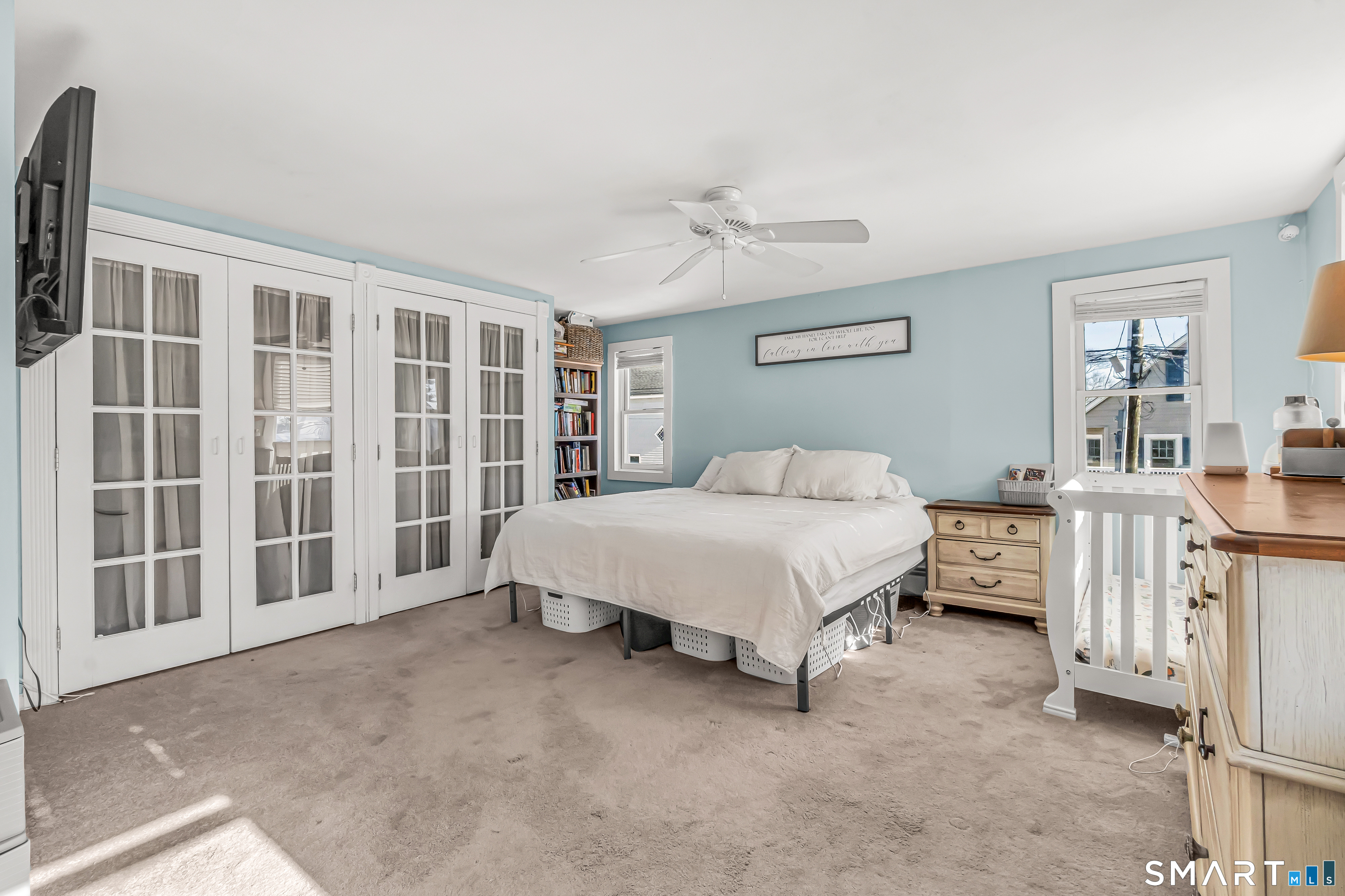 106 Hawley Avenue Milford, CT 06460 - Photo 2 of 39 a spacious bedroom with a bed and a cabinets