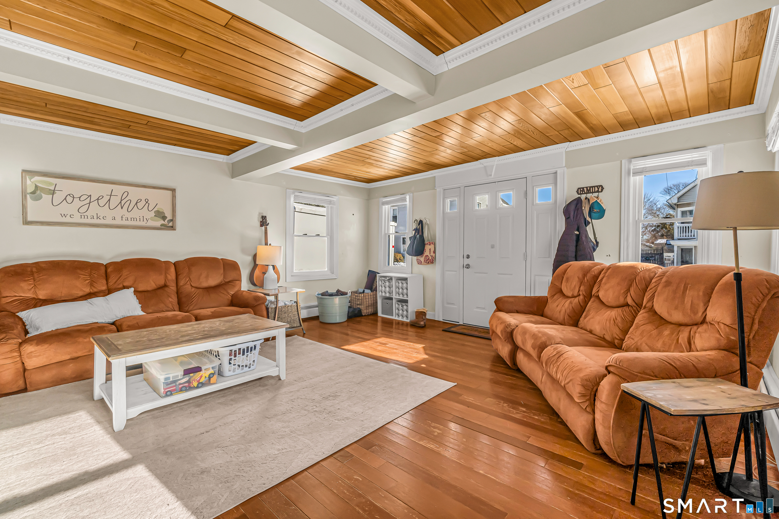 106 Hawley Avenue Milford, CT 06460 - Photo 29 of 39 a living room with furniture and a wooden floor