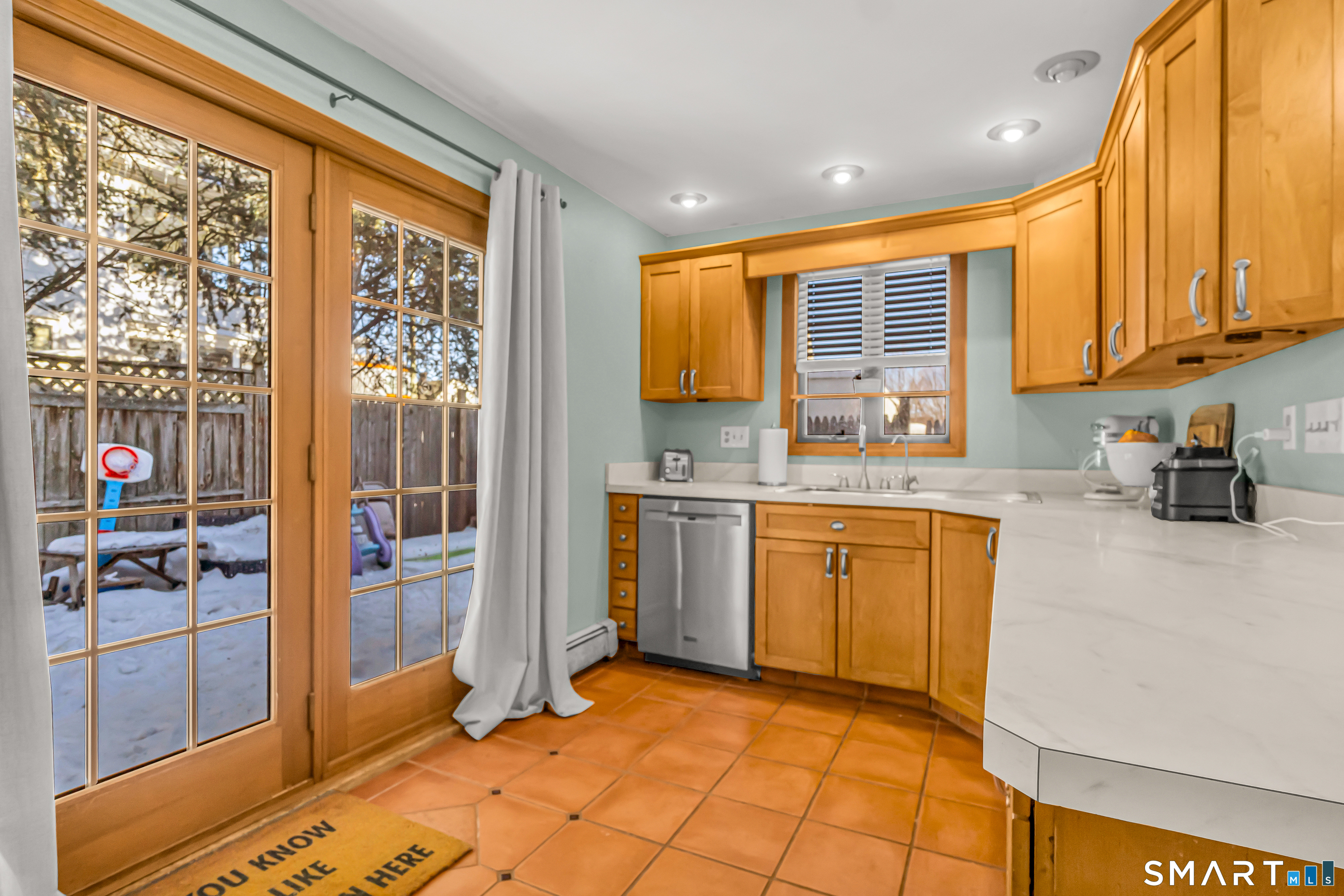 106 Hawley Avenue Milford, CT 06460 - Photo 33 of 39 a kitchen with granite countertop a stove a sink and a refrigerator