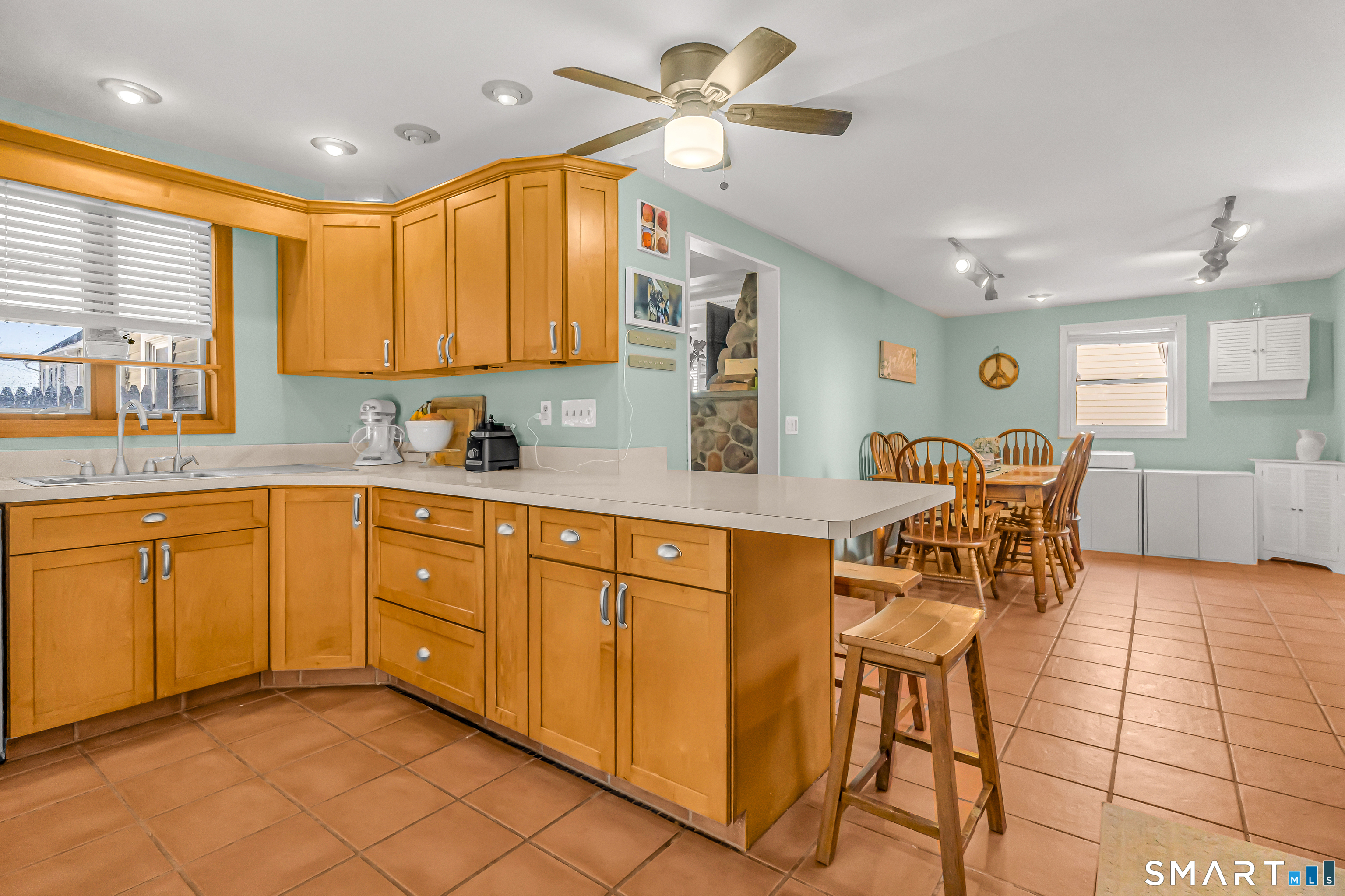 106 Hawley Avenue Milford, CT 06460 - Photo 34 of 39 a kitchen with stainless steel appliances granite countertop sink window and white cabinets