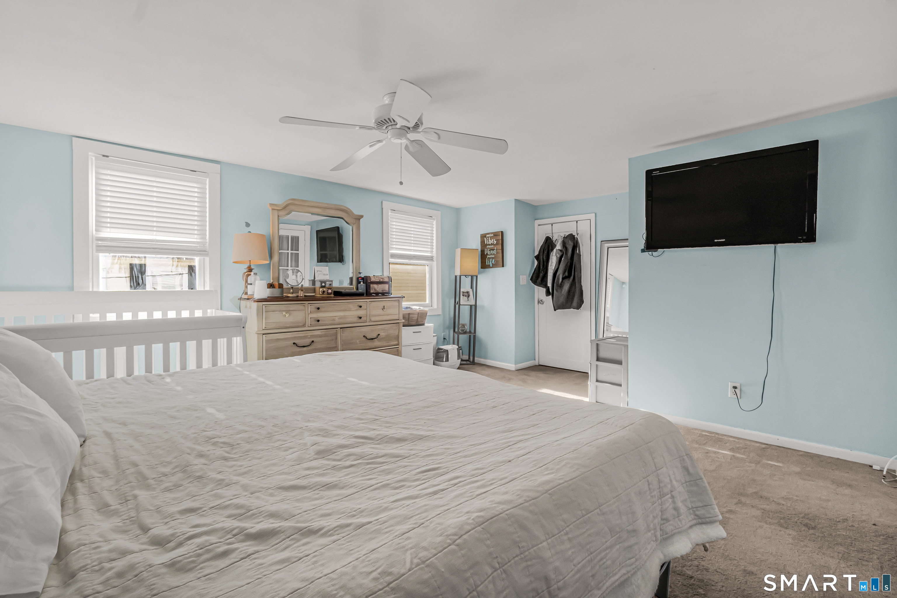 106 Hawley Avenue Milford, CT 06460 - Photo 5 of 39 a bedroom with a bed and a flat screen tv