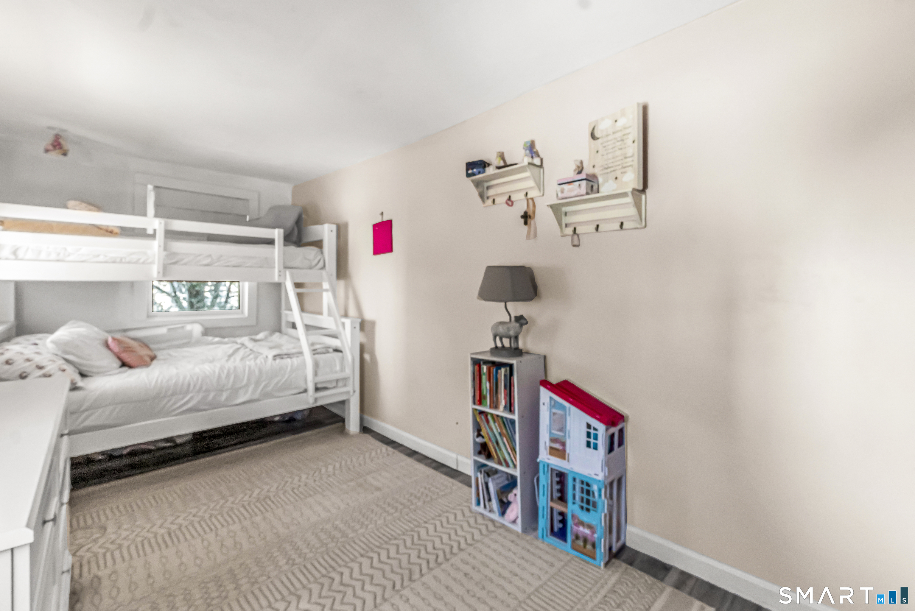 106 Hawley Avenue Milford, CT 06460 - Photo 6 of 39 a bedroom with a bed and a chandelier