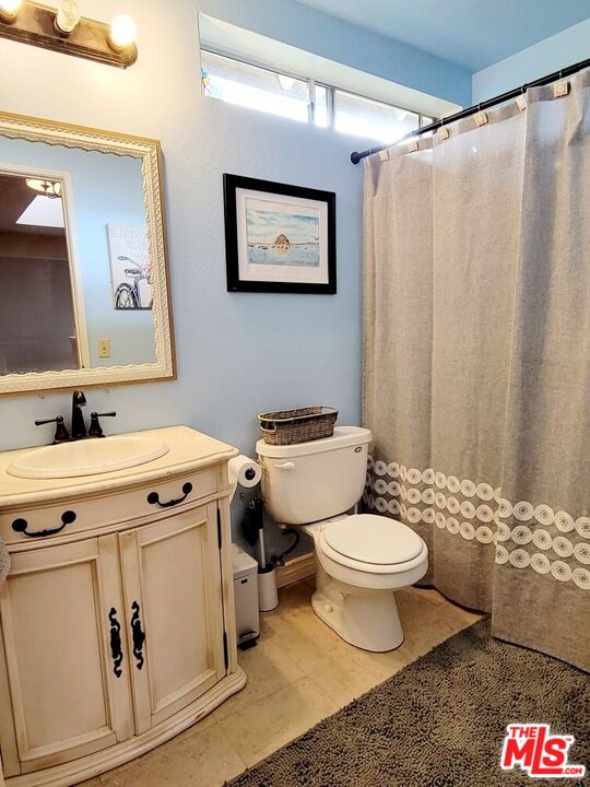 1744 Crystal Ridge Way Vista, CA 92081 - Photo 12 of 20 a bathroom with a sink toilet and shower