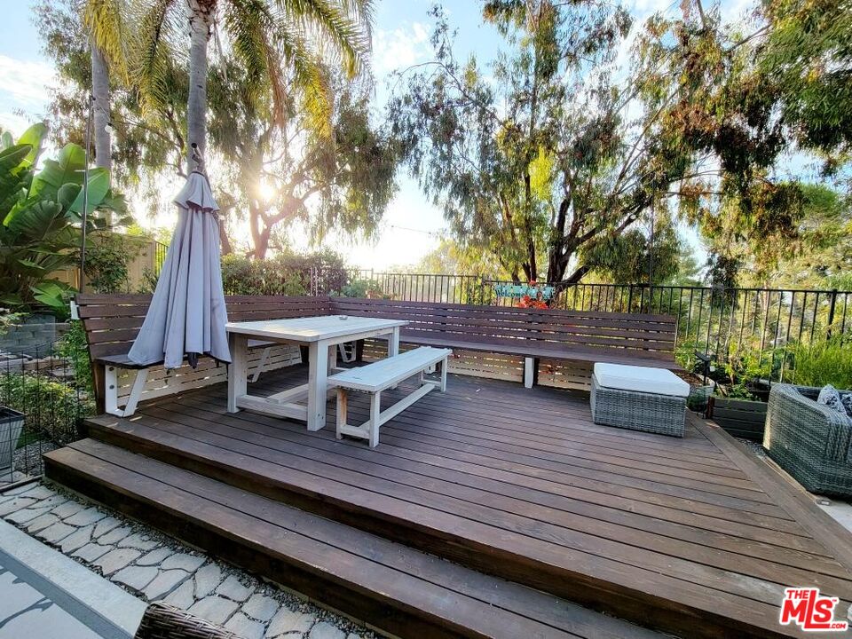 1744 Crystal Ridge Way Vista, CA 92081 - Photo 16 of 20 a view of a roof deck with couches and wooden floor
