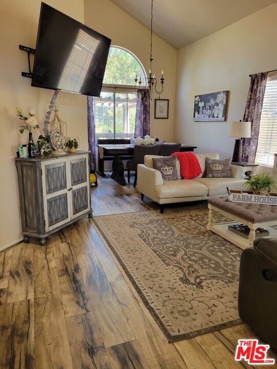 1744 Crystal Ridge Way Vista, CA 92081 - Photo 2 of 20 a living room with furniture and a flat screen tv
