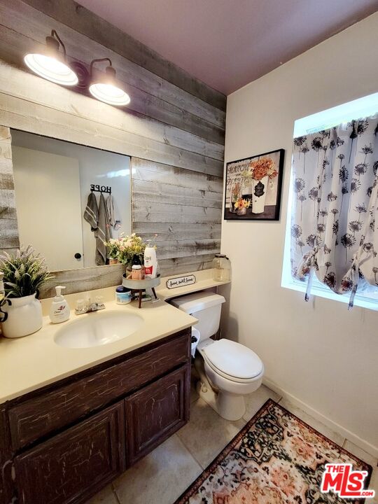 1744 Crystal Ridge Way Vista, CA 92081 - Photo 7 of 20 a bathroom with a sink mirror vanity and toilet