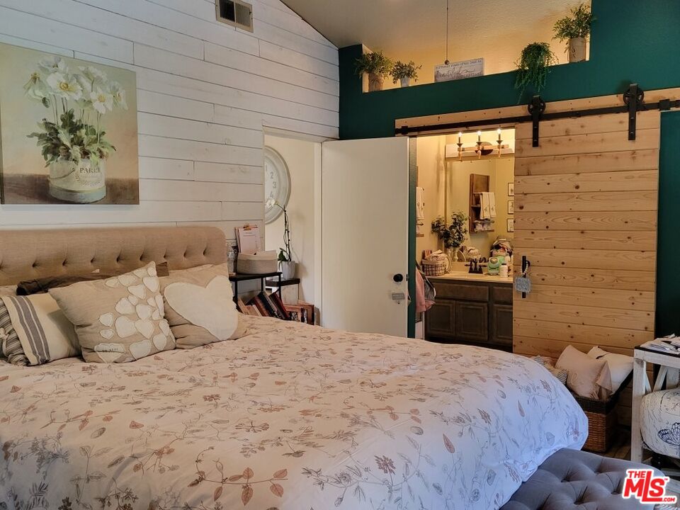 1744 Crystal Ridge Way Vista, CA 92081 - Photo 9 of 20 a bedroom with a bed and a window