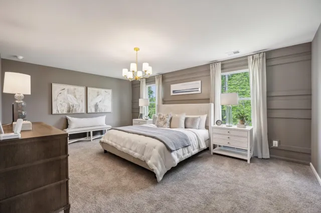 a spacious bedroom with a bed and window