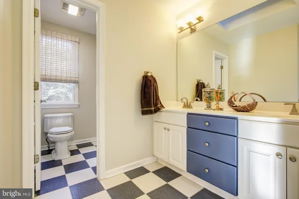 a bathroom with a toilet a sink and a bathtub