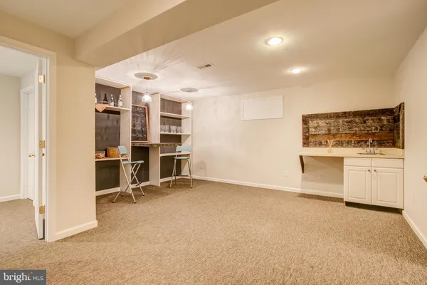 a view of a room with a closet and wooden floor
